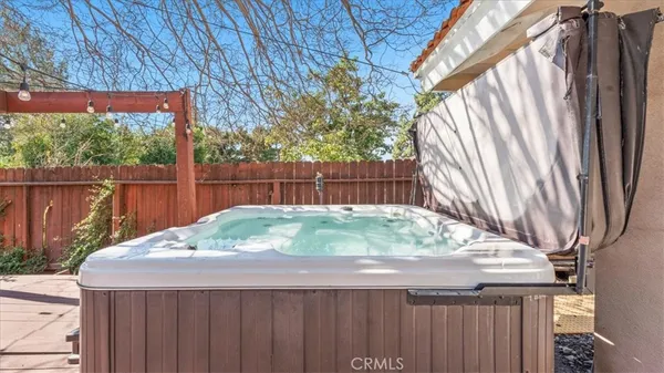 a small yard with a table and a chairs