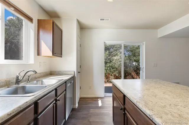 a kitchen with a sink and a window