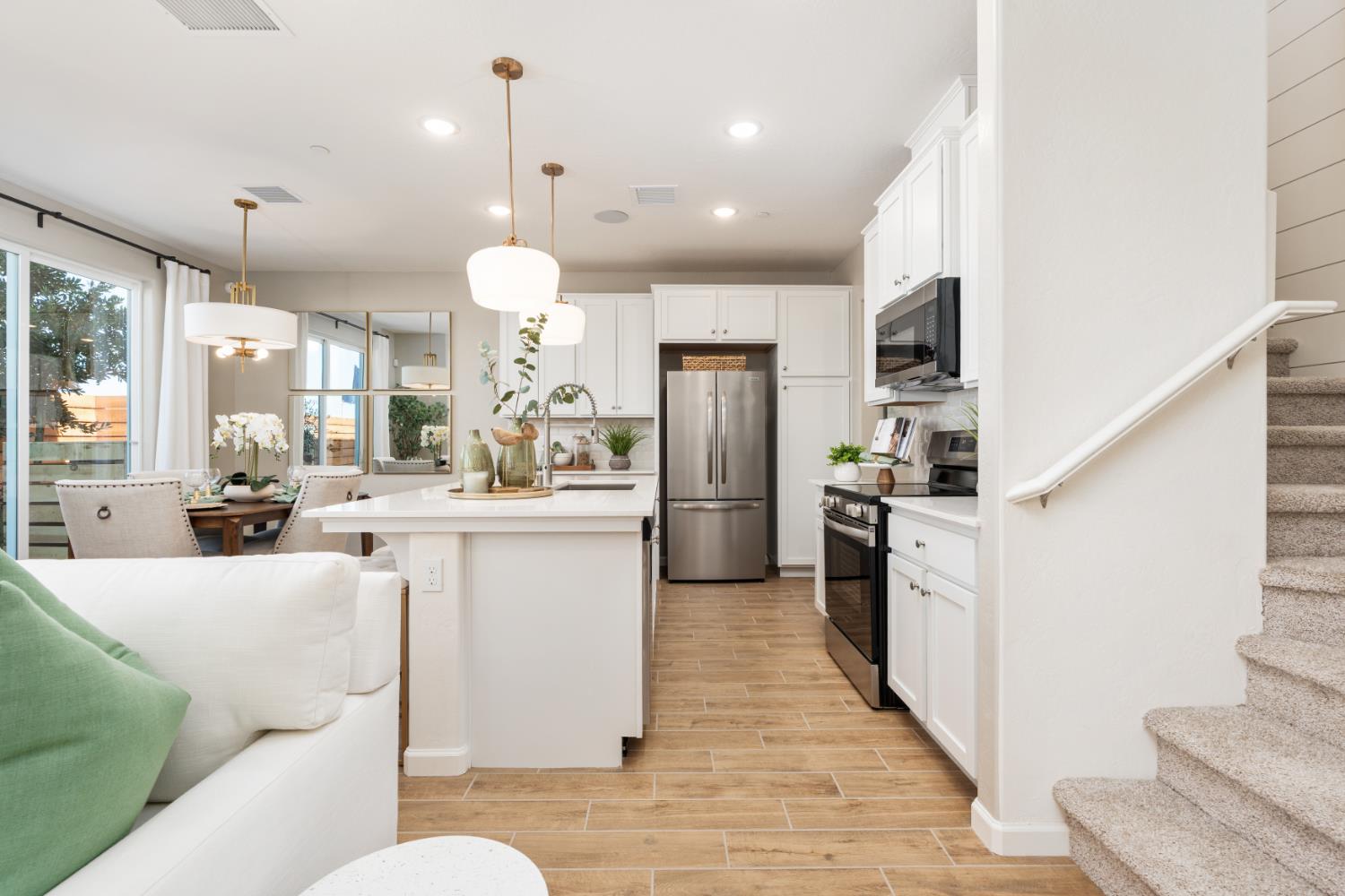 1538 Redbrick Lane Clovis, CA 93619 - Photo 8 of 34 a kitchen with stainless steel appliances kitchen island granite countertop a refrigerator a oven a sink and a refrigerator