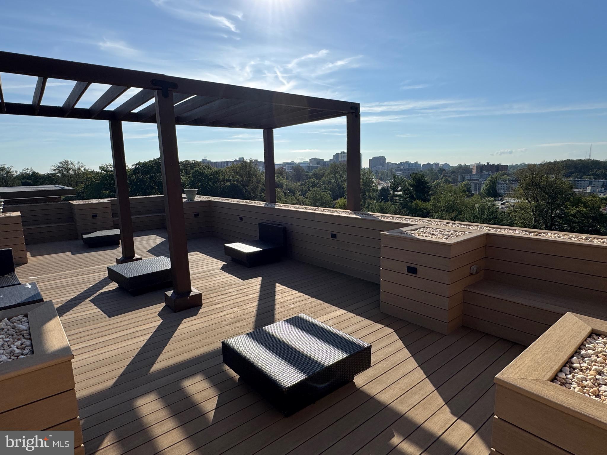 1900 Lyttonsville Road, Unit 417 Silver Spring, MD 20910 - Photo 13 of 15 a living room with furniture and a floor to ceiling window