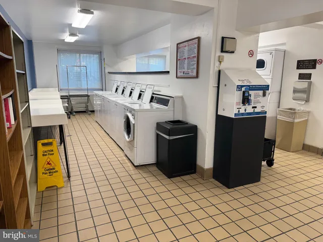 a kitchen with stainless steel appliances granite countertop a refrigerator and a stove
