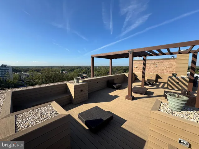 a view of a terrace with seating area and furniture