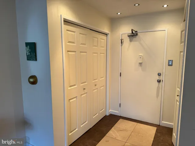 a bathroom with a shower and a glass door