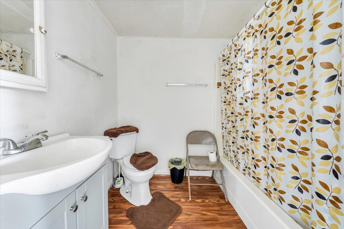 1726 Hendricks Store Road Moneta, VA 24121 - Photo 12 of 35 a bathroom with a sink and mirror with toilet