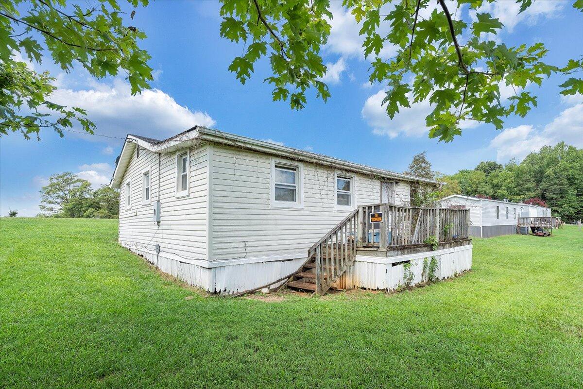 1726 Hendricks Store Road Moneta, VA 24121 - Photo 18 of 35 a view of a house with a yard and sitting area