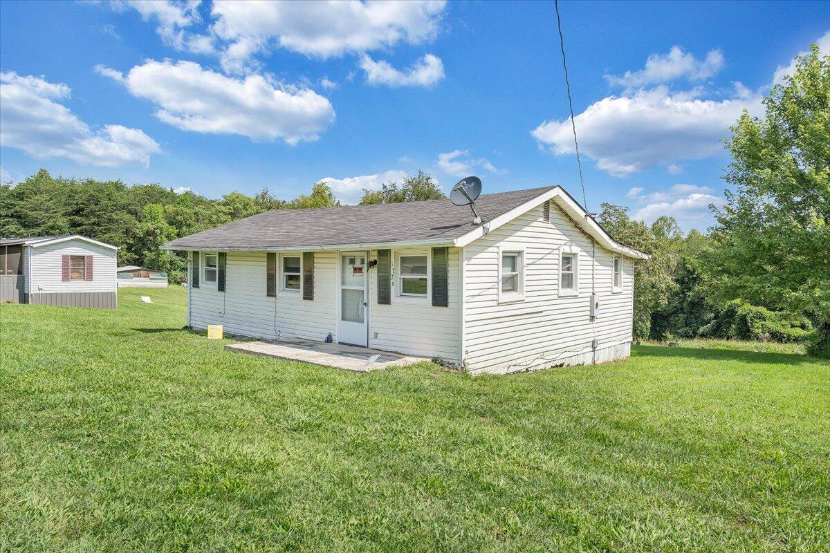 1726 Hendricks Store Road Moneta, VA 24121 - Photo 21 of 35 a front view of a house with a yard