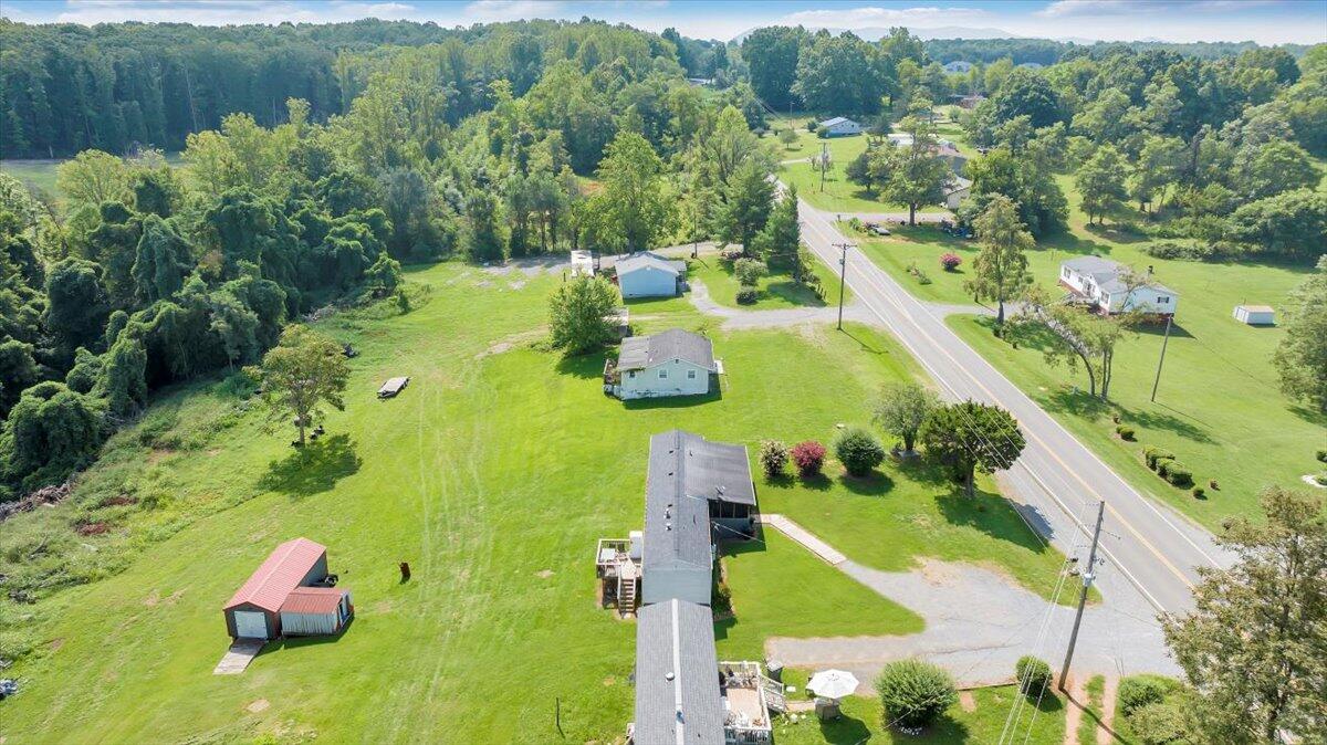 1726 Hendricks Store Road Moneta, VA 24121 - Photo 30 of 35 an aerial view of a house with yard swimming pool and lake view