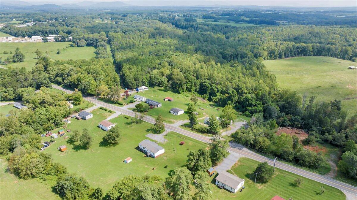 1726 Hendricks Store Road Moneta, VA 24121 - Photo 33 of 35 a view of a lush green forest with a house