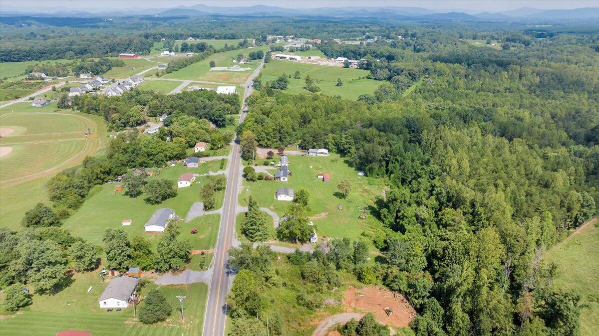 1726 Hendricks Store Road Moneta, VA 24121 - Photo 34 of 35 an aerial view of residential houses with outdoor space and trees