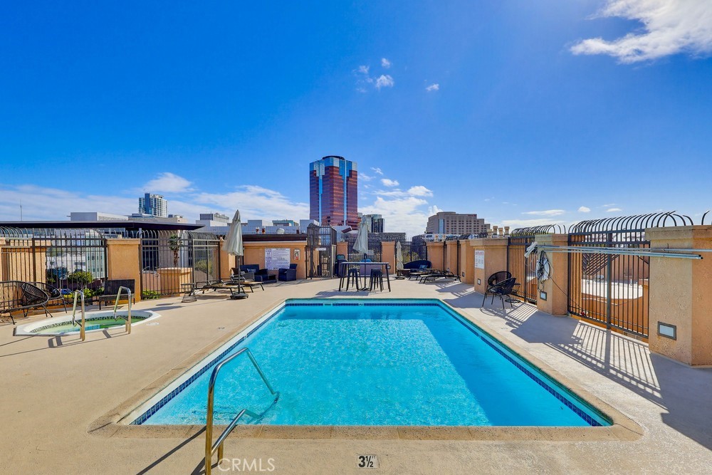 640 West 4th Street, Unit 401 Long Beach, CA 90802 - Photo 12 of 14 a living room with furniture a pool table and chairs