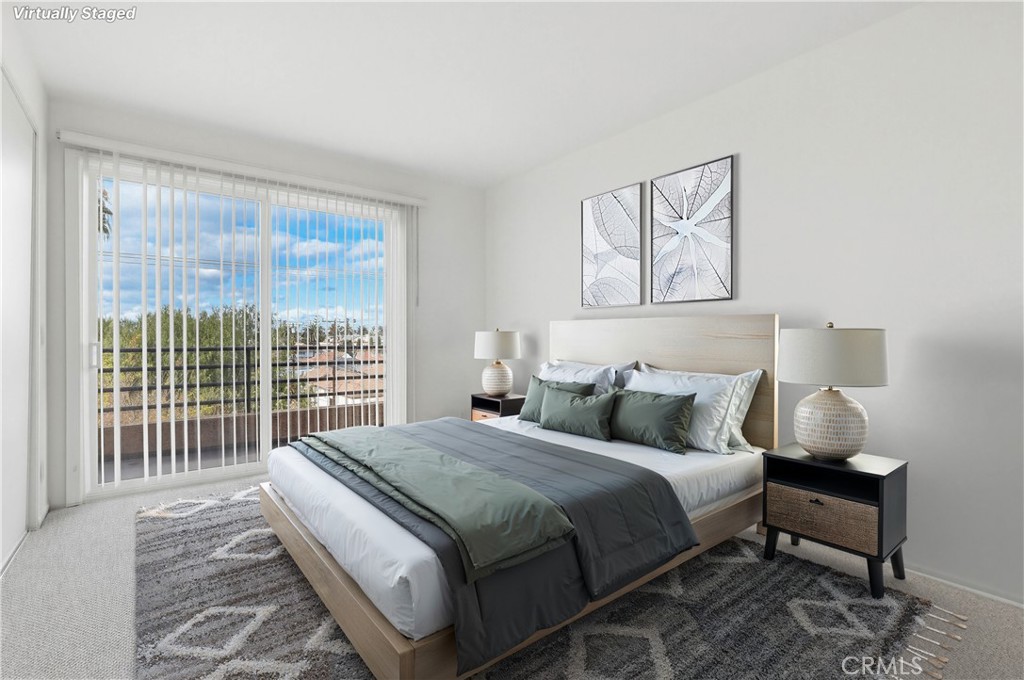 640 West 4th Street, Unit 401 Long Beach, CA 90802 - Photo 9 of 14 a bedroom with a bed and a large window