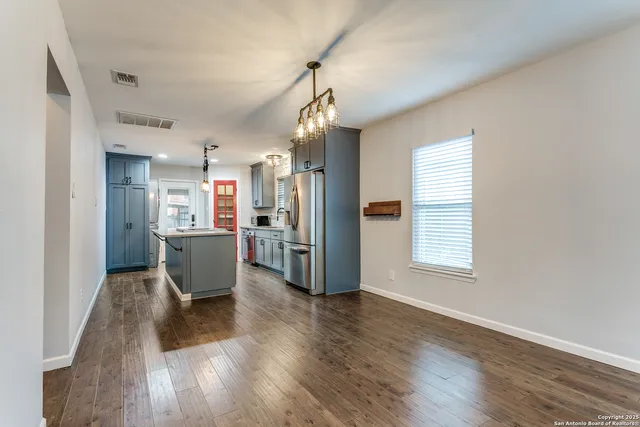 a view of a kitchen and dining room