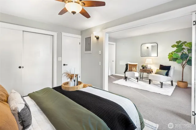 a bedroom with a bed and a lamp