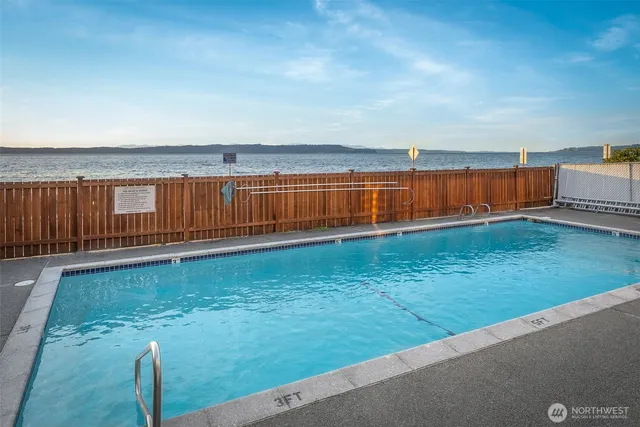 a view of a backyard with a lake view