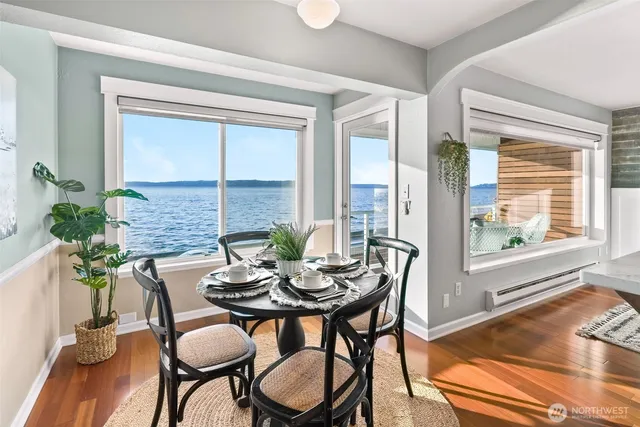 a dining room with furniture and wooden floor