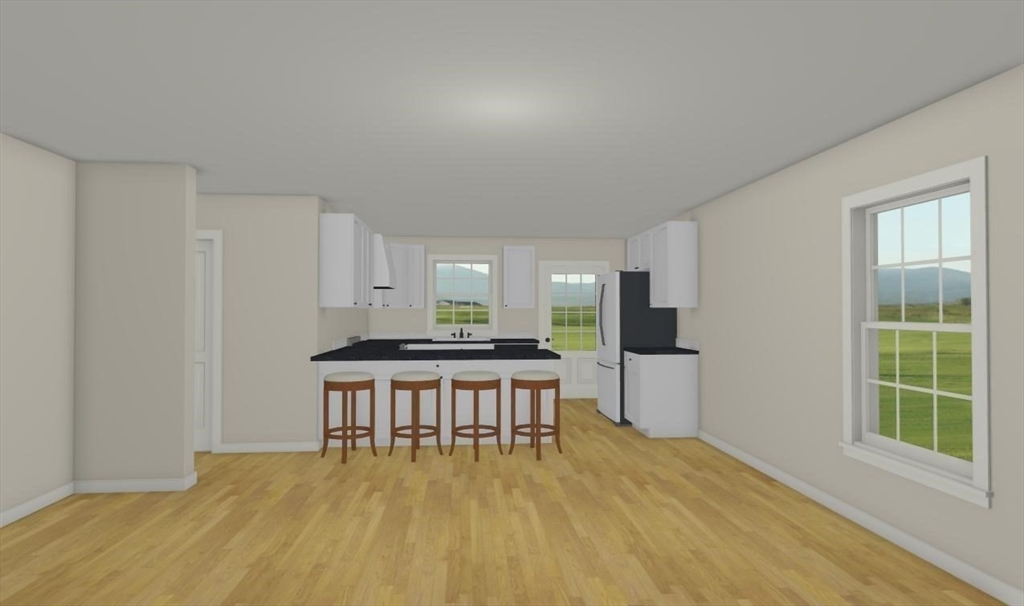 290 West Street, Unit C Amherst, MA 01002 - Photo 7 of 16 a kitchen with stainless steel appliances a stove a refrigerator a sink with white cabinets and wooden floor