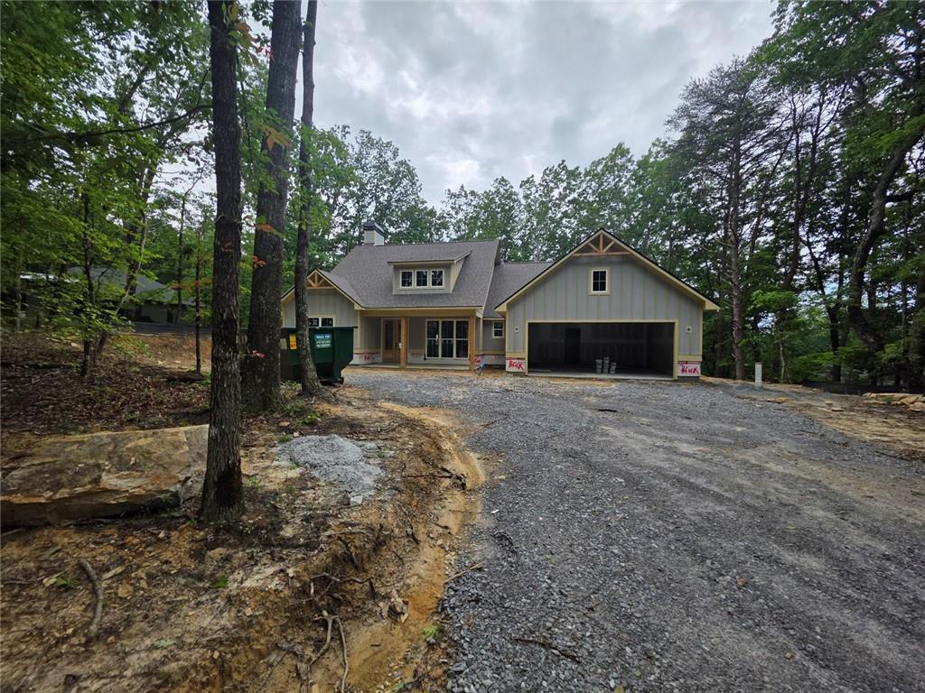 86 Turkey Trail Jasper, GA 30143 - Photo 3 of 13 a front view of a house with a yard and garage