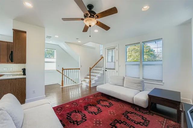 a living room with furniture and a rug