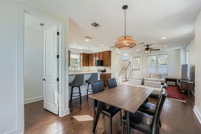 a view of a dining room with furniture window and wooden floor