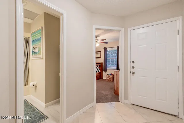 a view of a bathroom from a hallway
