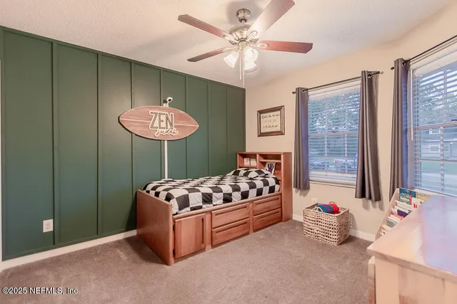 a living room with furniture chandelier and a window