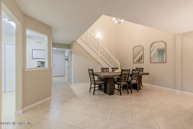 a view of a livingroom with furniture and chandelier