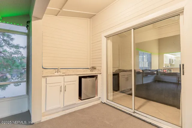 a sign broad in front of the tree