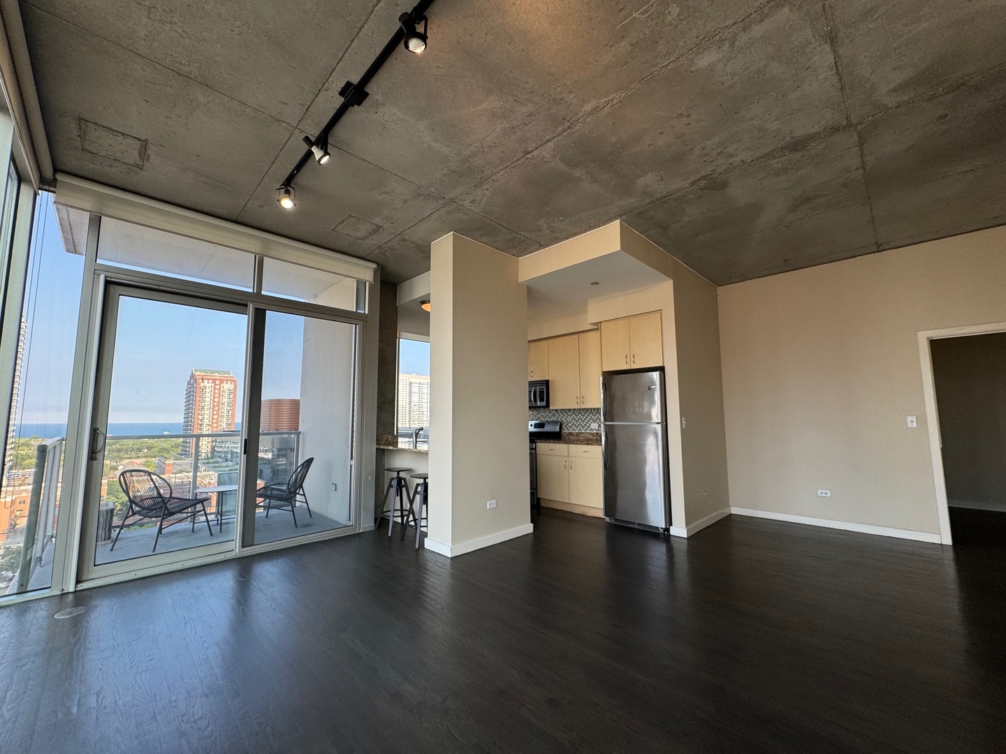 1720 South Michigan Avenue, Unit 1401 Chicago, IL 60616 - Photo 2 of 13 a view of a room with wooden floor and window