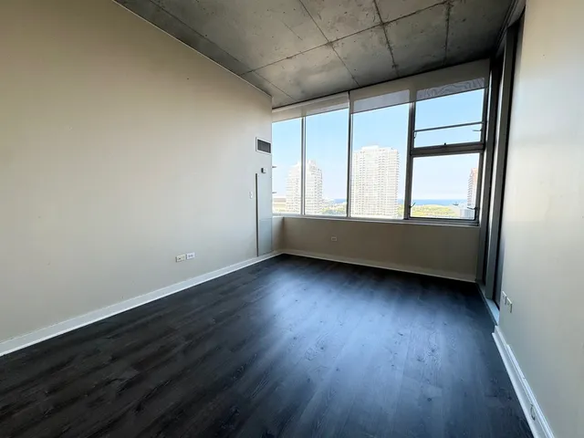 a view of wooden floor in an empty room