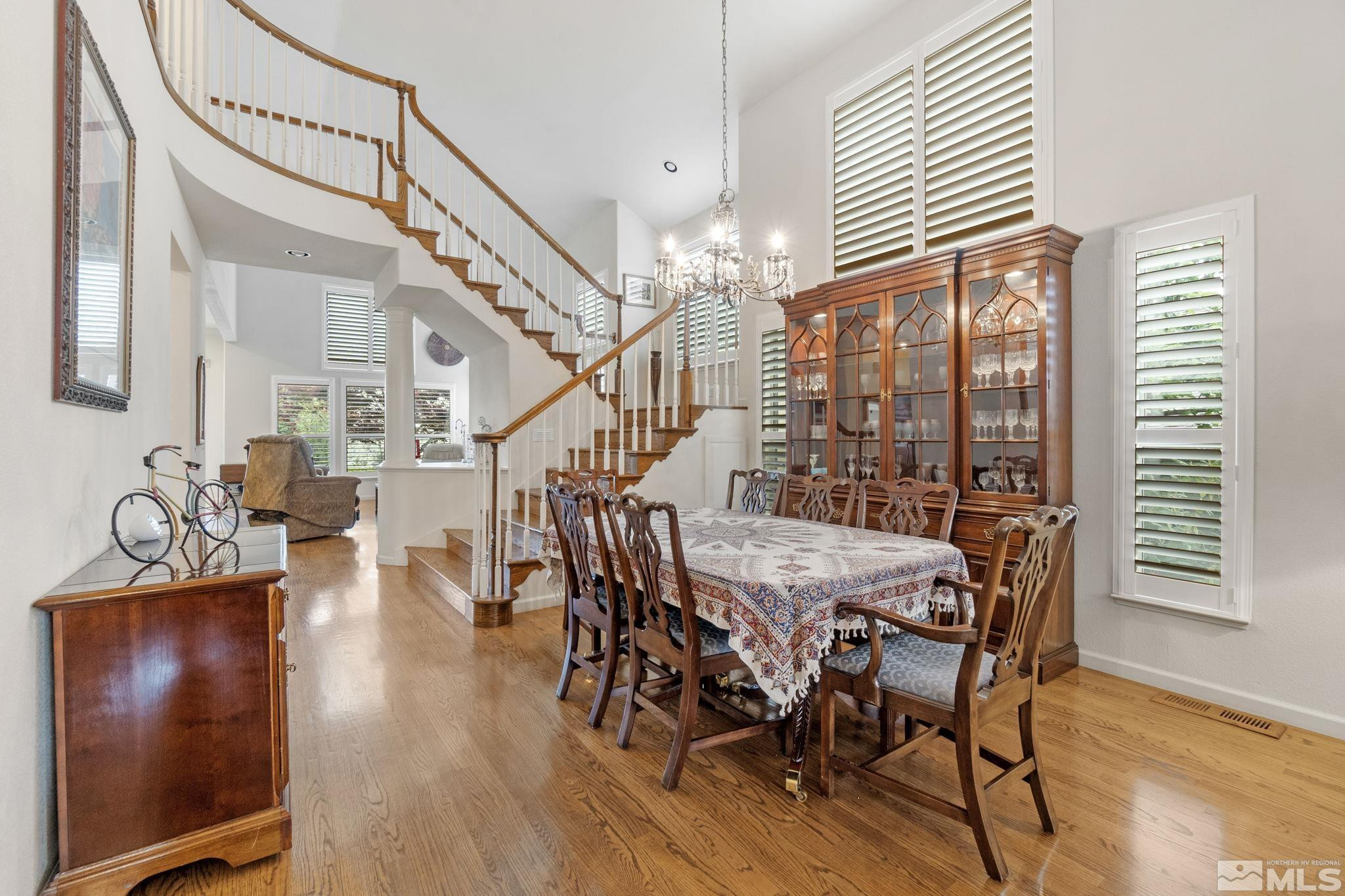 6142 Carriage House Way Reno, NV 89519 - Photo 12 of 40 a dining room with furniture entryway and wooden floor