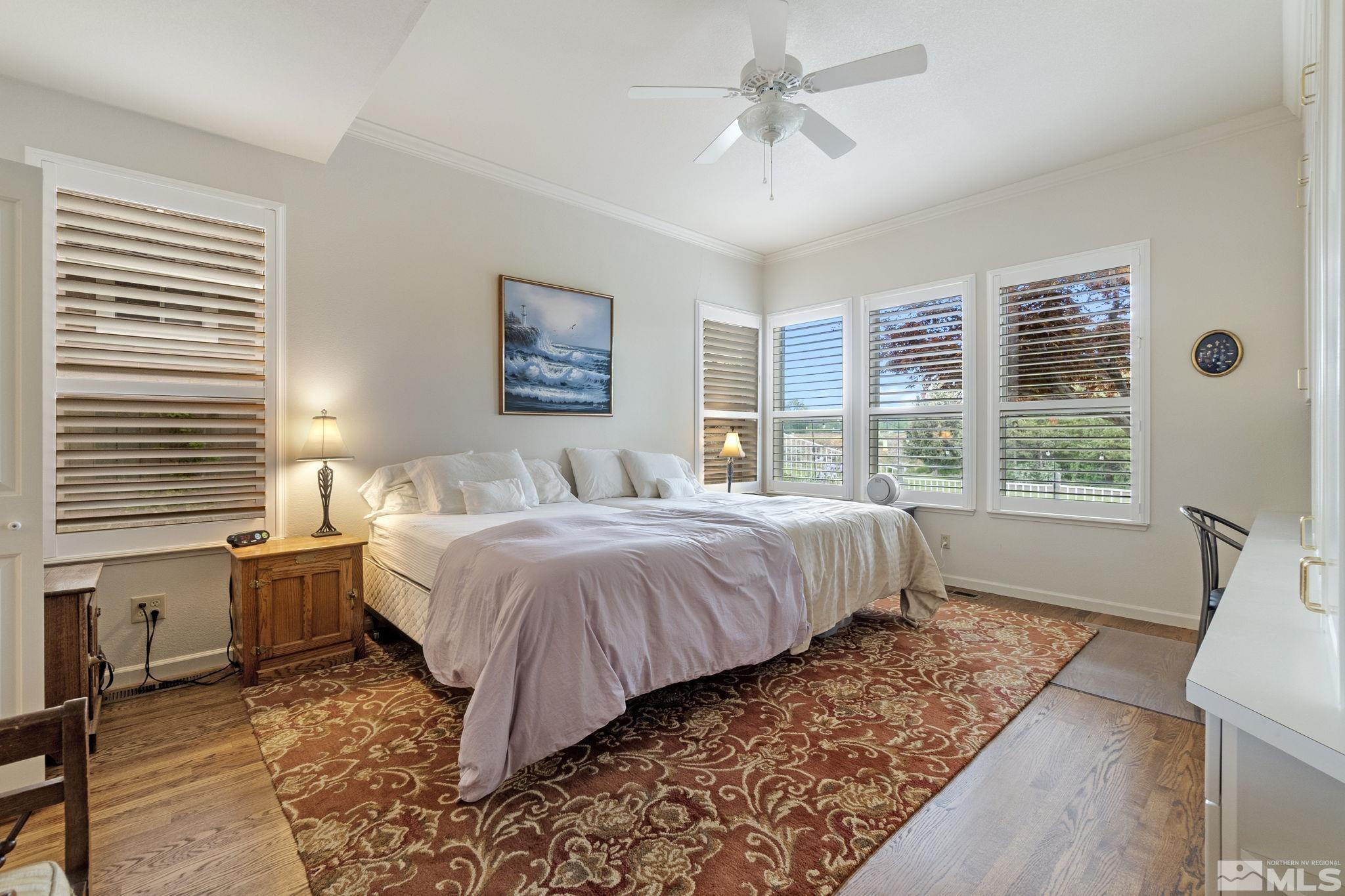 6142 Carriage House Way Reno, NV 89519 - Photo 27 of 40 a bedroom with a large bed and a window