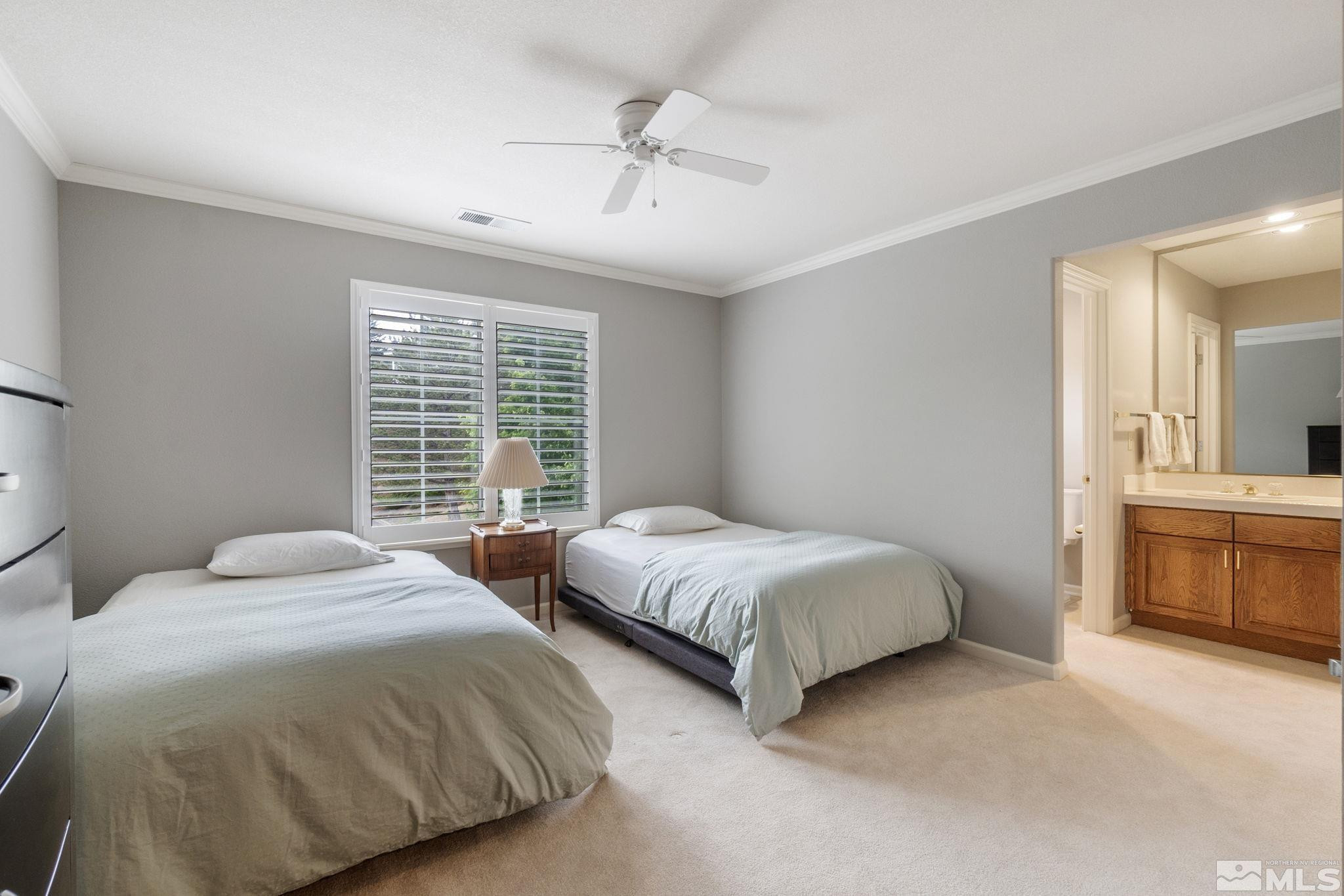 6142 Carriage House Way Reno, NV 89519 - Photo 33 of 40 a bedroom with two beds and a dresser