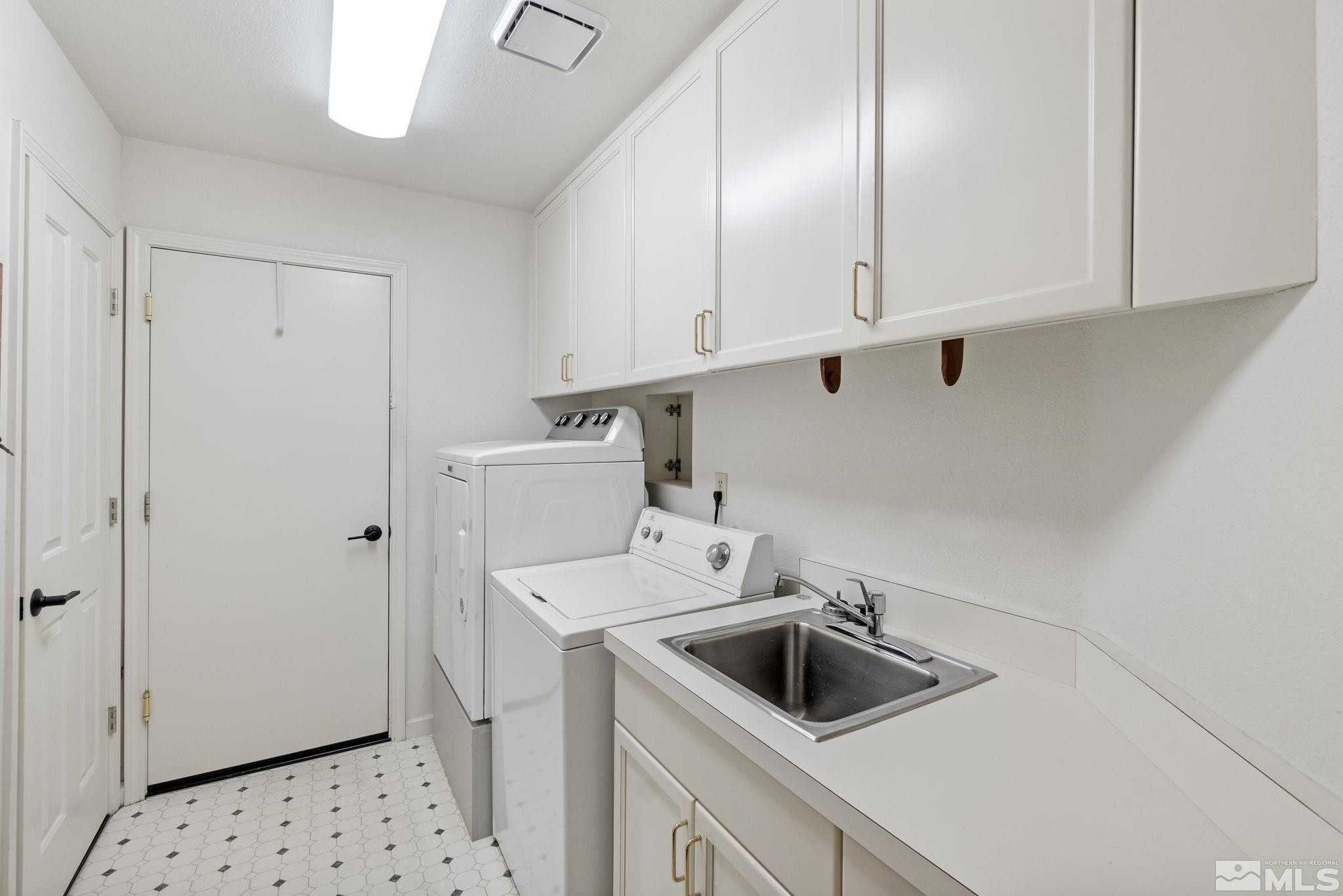 6142 Carriage House Way Reno, NV 89519 - Photo 37 of 40 a kitchen with a sink and cabinets