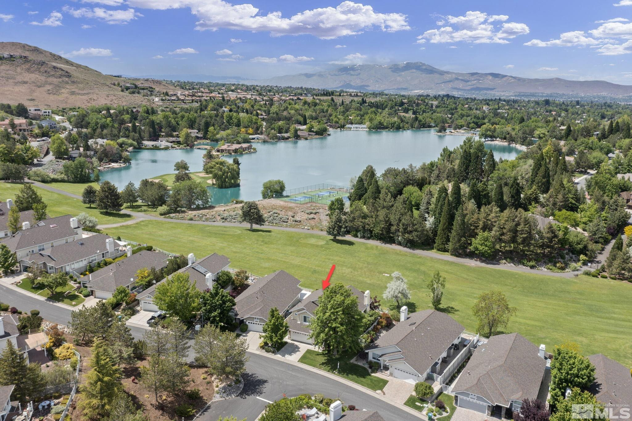 6142 Carriage House Way Reno, NV 89519 - Photo 4 of 40 a view of a lake with a city