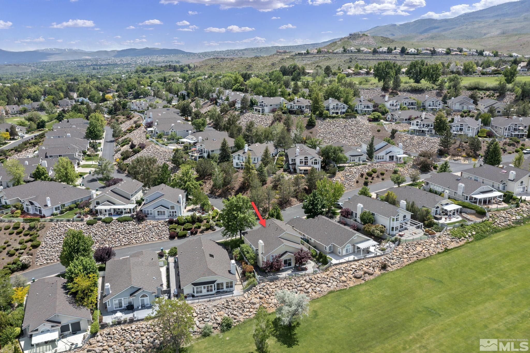 6142 Carriage House Way Reno, NV 89519 - Photo 5 of 40 an aerial view of a houses with a yard