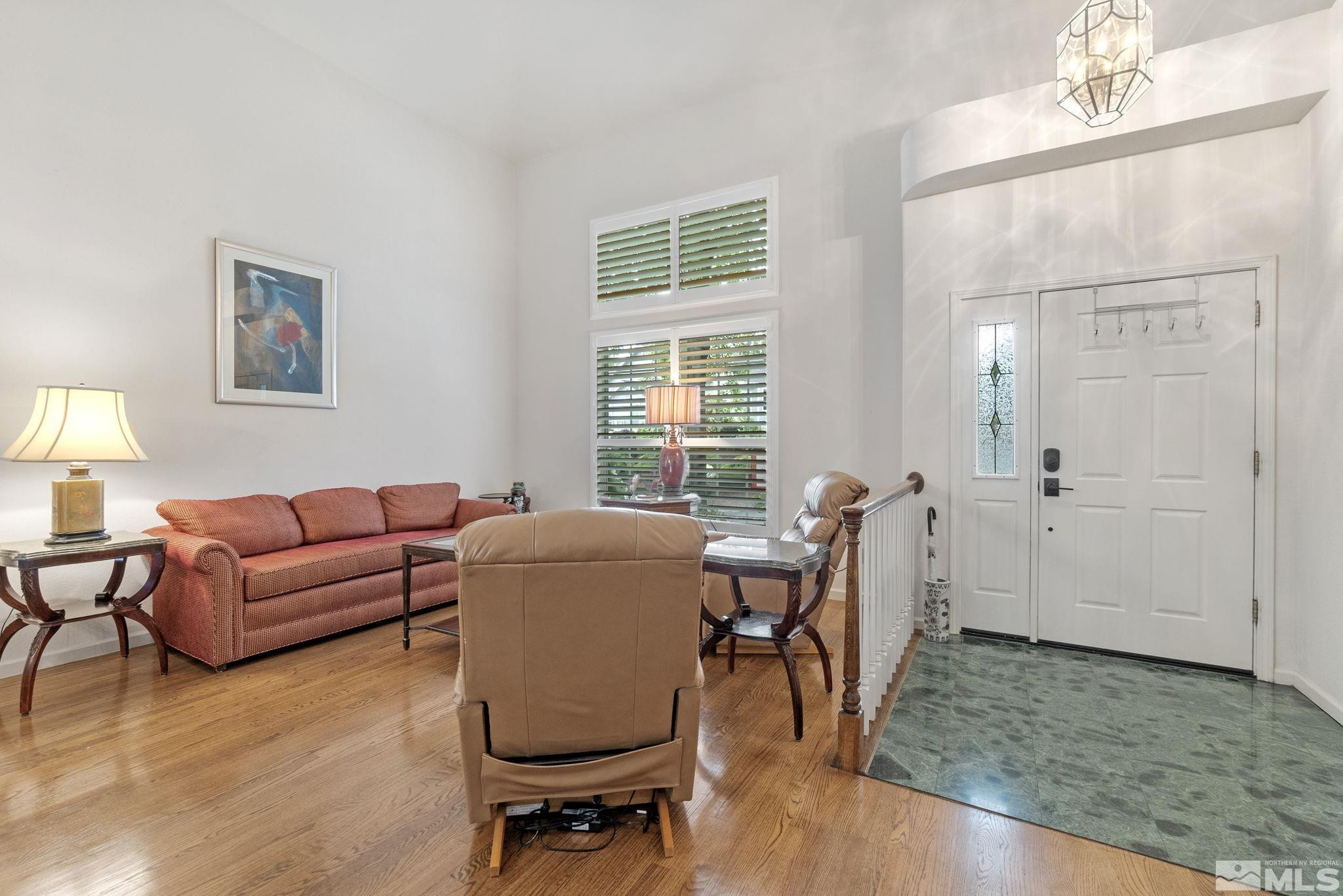 6142 Carriage House Way Reno, NV 89519 - Photo 8 of 40 a living room with furniture and a window