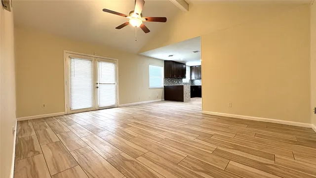 a kitchen with granite countertop stainless steel appliances and wooden cabinets