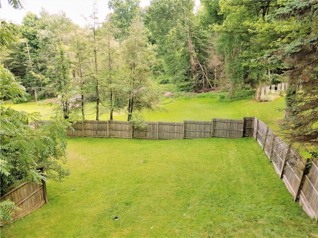5424 Hardt Road Gibsonia, PA 15044 - Photo 2 of 24 Over 1/2 acre lot, partially fenced in. Property line goes into the woods in the back.