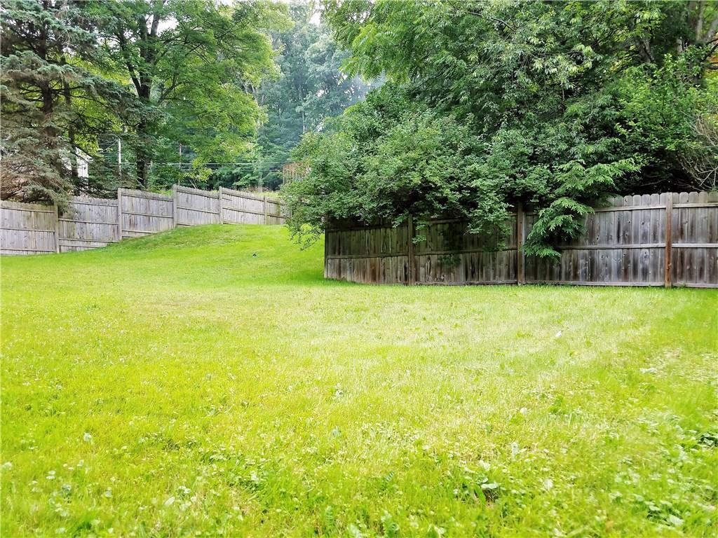 5424 Hardt Road Gibsonia, PA 15044 - Photo 22 of 24 Fenced in area in the shape of an L for plenty of space for playing and running.