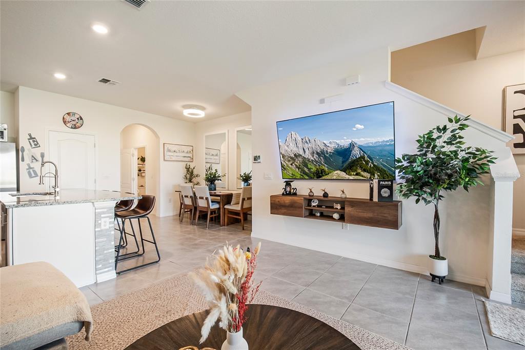 1359 Isleta Loop Kissimmee, FL 34741 - Photo 21 of 57 a living room with furniture and a potted plant