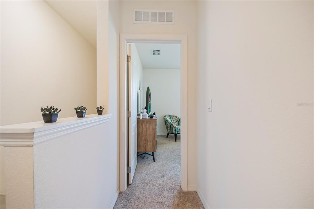 1359 Isleta Loop Kissimmee, FL 34741 - Photo 24 of 57 a view of a hallway with dining room and front door
