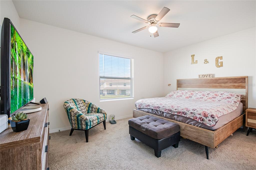 1359 Isleta Loop Kissimmee, FL 34741 - Photo 26 of 57 a bedroom with a bed and a window