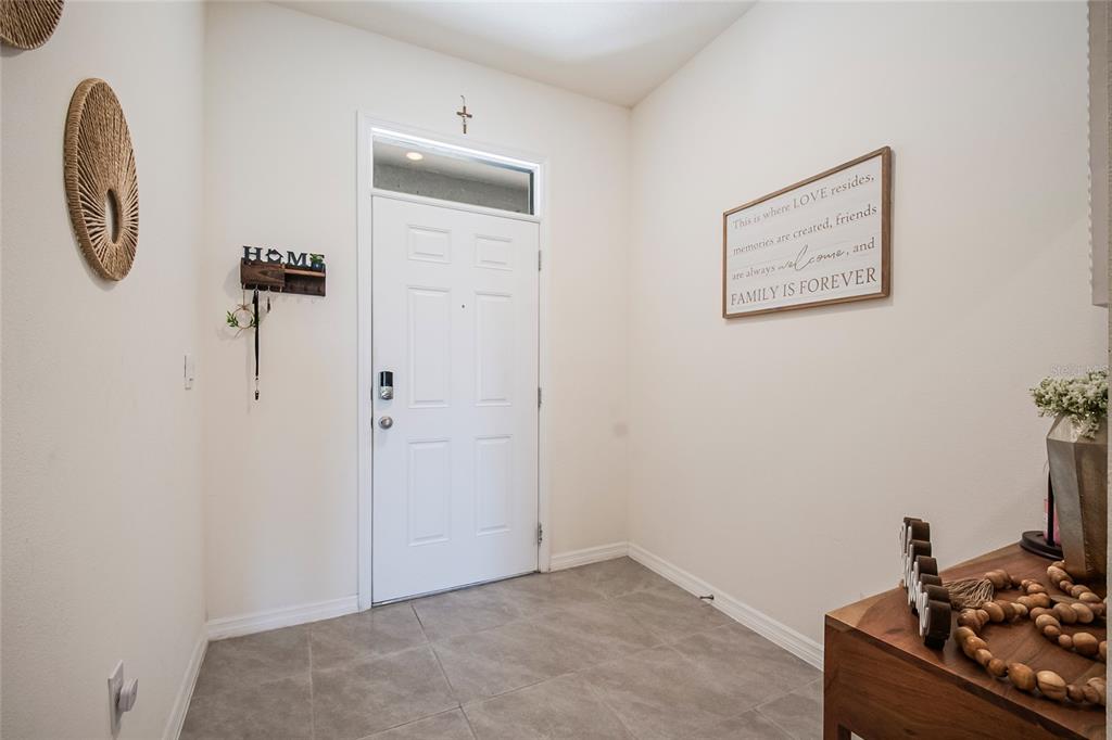 1359 Isleta Loop Kissimmee, FL 34741 - Photo 3 of 57 a view of a room with rack on the wall