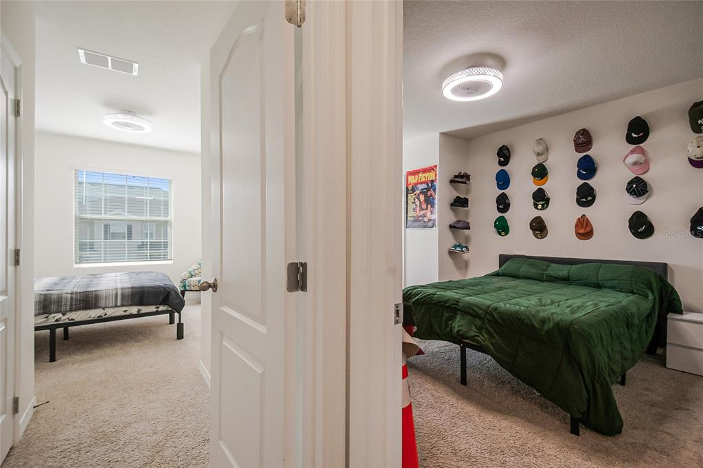 1359 Isleta Loop Kissimmee, FL 34741 - Photo 33 of 57 a en suite bathroom with a sink and a mirror