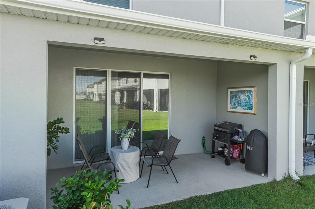 1359 Isleta Loop Kissimmee, FL 34741 - Photo 39 of 57 a view of backyard with outdoor seating and plants