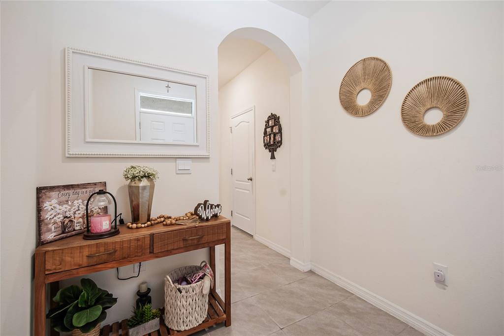 1359 Isleta Loop Kissimmee, FL 34741 - Photo 4 of 57 a bathroom with a granite countertop sink and a mirror