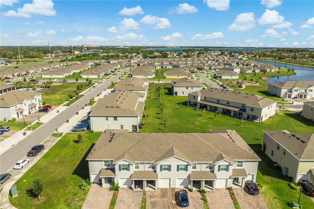 1359 Isleta Loop Kissimmee, FL 34741 - Photo 45 of 57 an aerial view of a house with a lake view