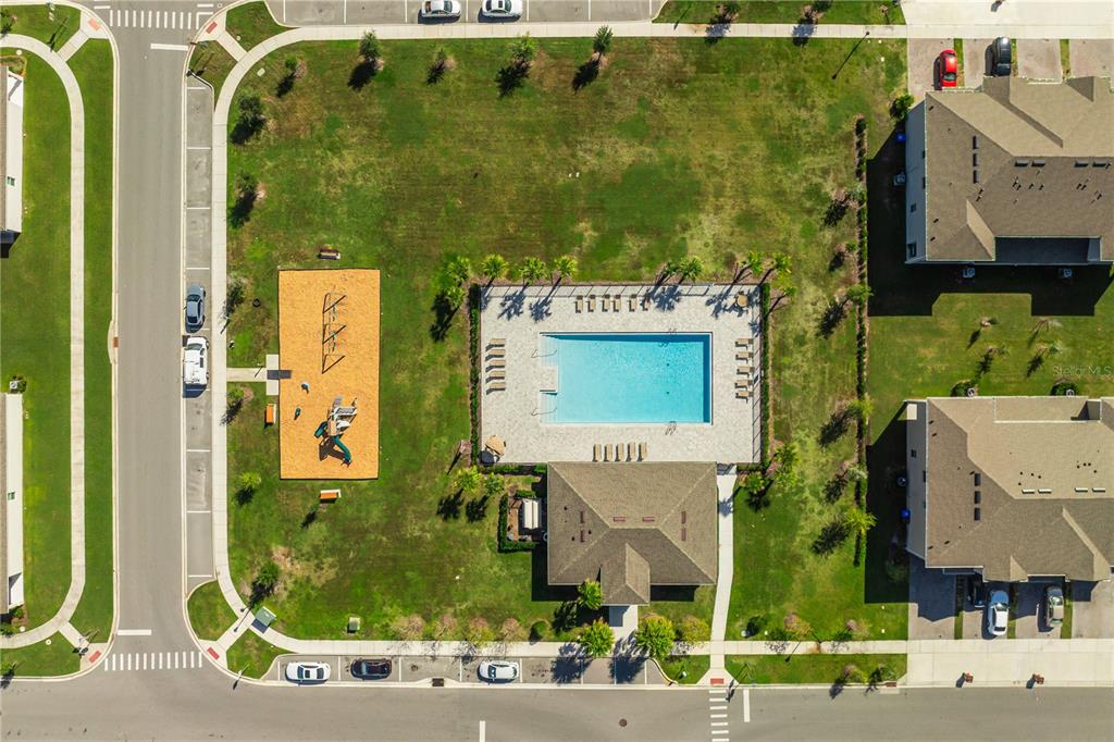1359 Isleta Loop Kissimmee, FL 34741 - Photo 55 of 57 an aerial view of a residential apartment building with a yard