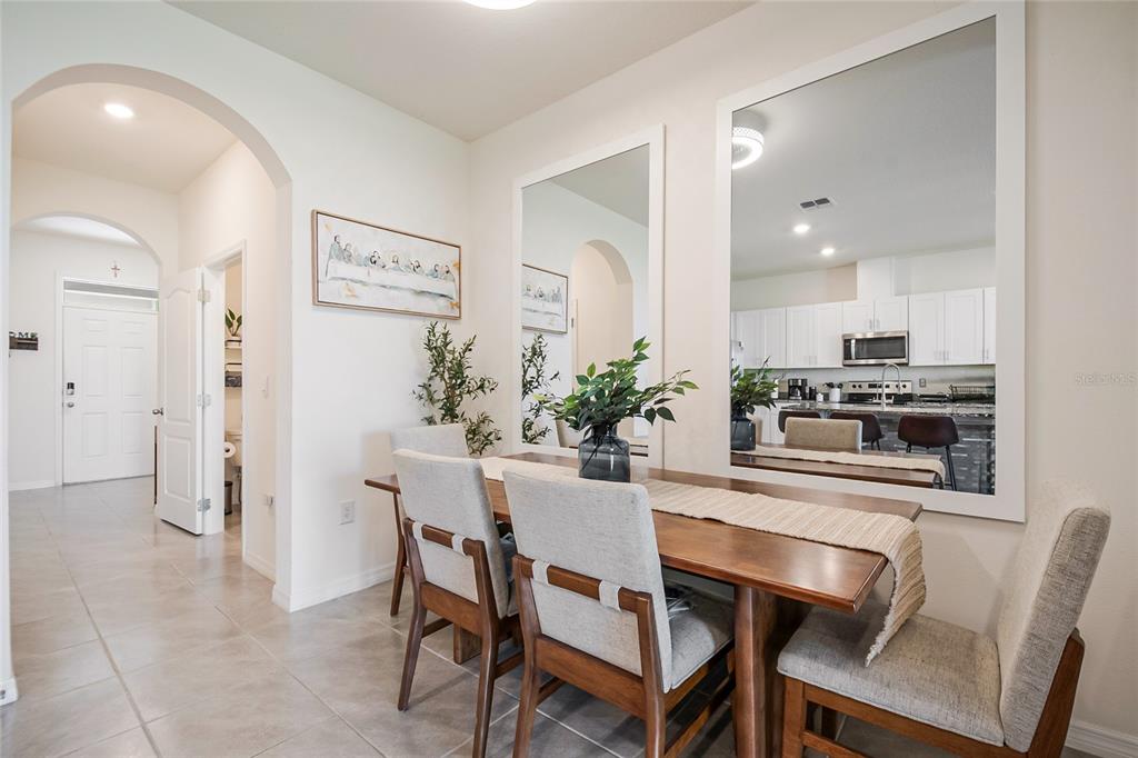 1359 Isleta Loop Kissimmee, FL 34741 - Photo 10 of 57 a dining room with furniture and window