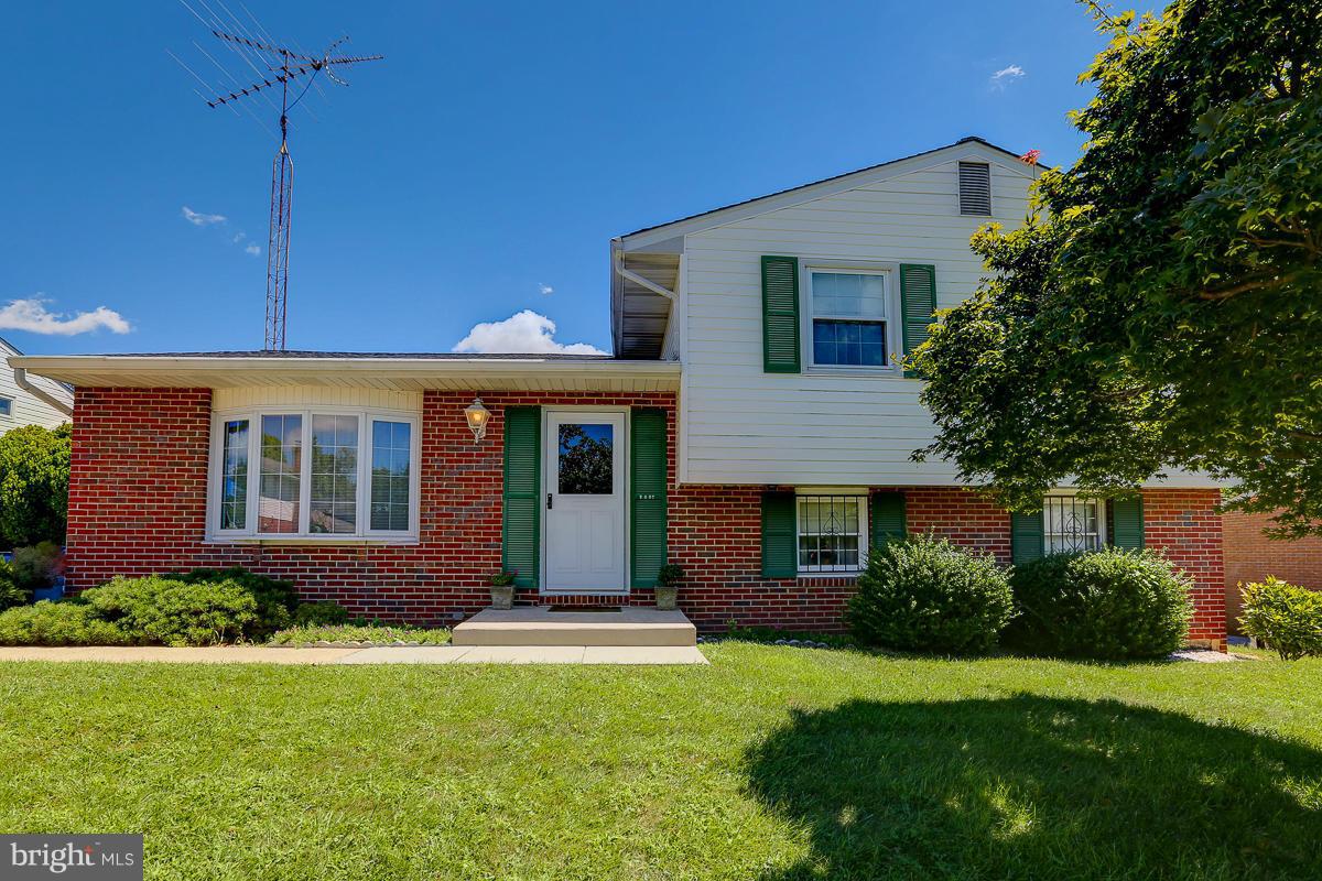 9007 Fieldchat Road Baltimore, MD 21236 - Photo 2 of 30 a front view of house with yard and green space